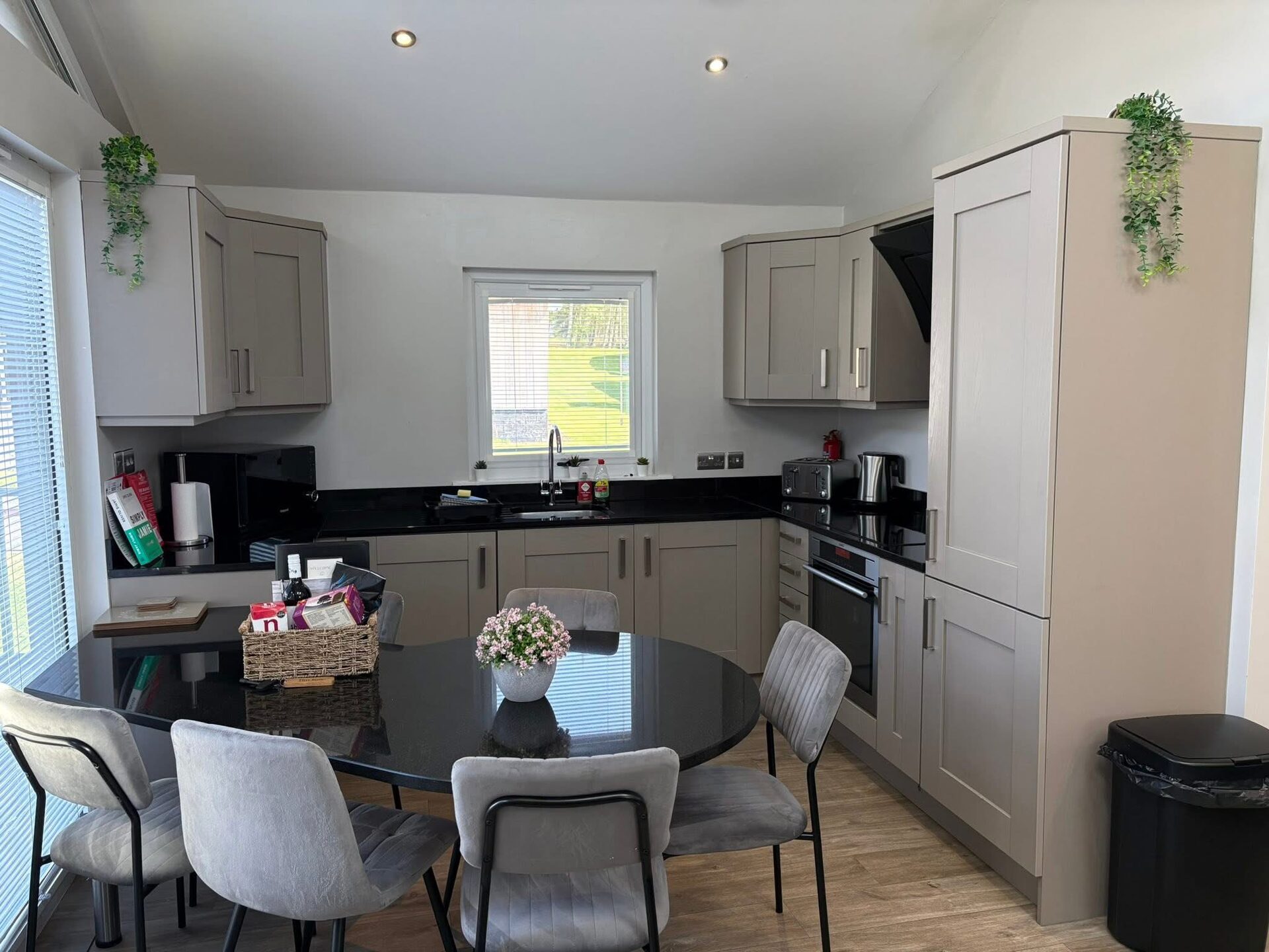 Kitchen and dining area with round black table